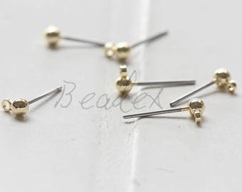 May include: Five gold-toned earring findings with a small ball at the end of each. The findings are made of metal and have a silver-toned wire.