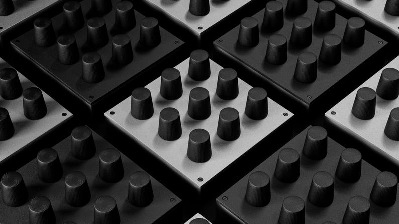 May include: A grayscale image showcasing multiple square electronic control panels. Each panel features a grid of black, cylindrical knobs. The panels alternate between black and light gray, creating a repeating pattern. The image is a close-up, highlighting the texture and design.