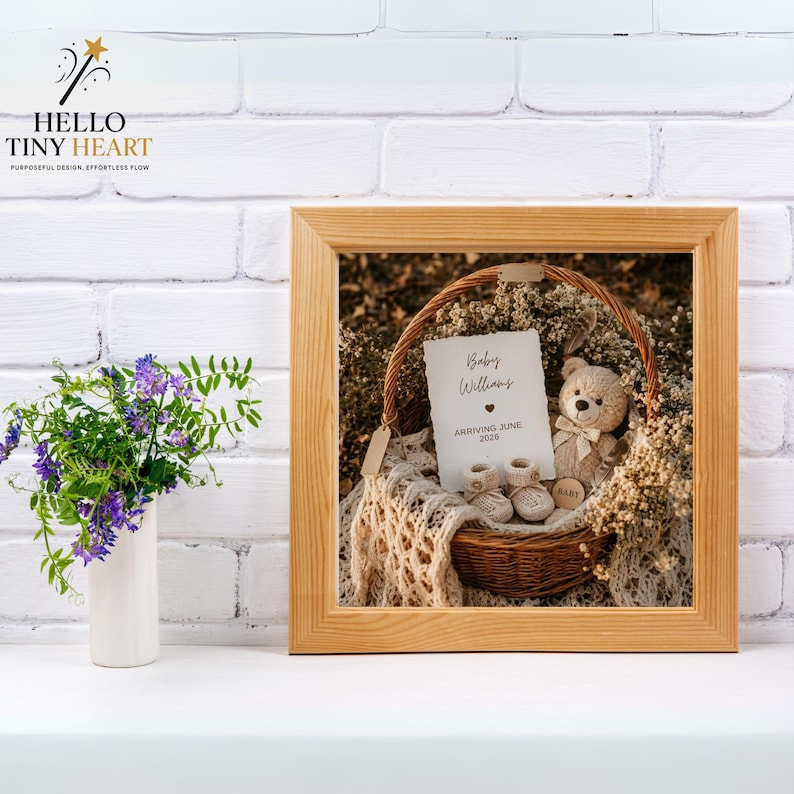 Rustic baby announcement basket featuring a plush teddy bear, cream knit booties, baby's breath flowers, and a card reading "Baby Williams Arriving June 2026" on a beige macrame blanket.