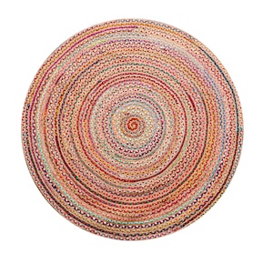 May include: A round braided rug featuring a concentric circular pattern. The rug is constructed from multi-colored fabric strips in shades of red, orange, yellow, pink, blue, and natural tan, woven together to create a textured, vibrant surface.