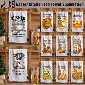 May include: A collection of white kitchen tea towels with various humorous phrases and illustrations. Designs include a coffee bar, dinner-related quotes, and religious themes. The towels are displayed on a wooden rack, with jars of star-shaped cookies.
