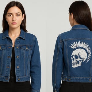 May include: Blue denim jacket with a button-up front and collared neckline. The back of the jacket features a white skull graphic with a mohawk. The jacket has two chest pockets and two side pockets.