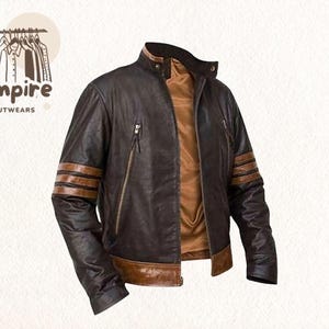 May include: A brown leather jacket with a stand-up collar and a brown interior. The jacket features brown stripes on the sleeves and two zipped pockets. The logo "Empire Outwears" is in the upper left corner.
