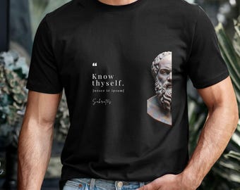 May include: Black t-shirt featuring the quote "Know thyself" in white text, with the Latin translation and the name Socrates. A partial image of a classical bust is on the right side of the shirt.