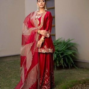 Heavy Chinon Silk top and sharara with cording sequins embroidery, paired with a printed Organza Silk dupatta—fully stitched and festive