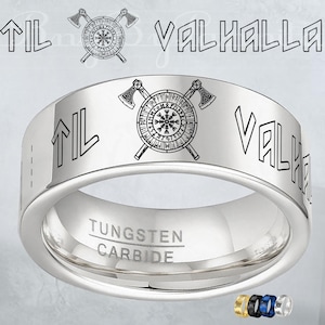 May include: A silver tungsten carbide ring with the words "TIL VALHALLA" engraved around the band. The ring features a Viking axe and rune symbol. The words "TUNGSTEN CARBIDE" are also engraved on the ring.