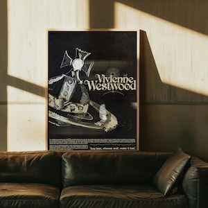 May include: A framed black and white poster with the Vivienne Westwood logo and a planet sketch. The poster is in a gold frame and has the text "buy less, choose well, make it last" at the bottom.