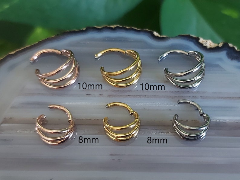 May include: Six seamless hoop earrings in three different sizes and colors: gold, rose gold, and silver. The earrings are 8mm and 10mm in diameter.