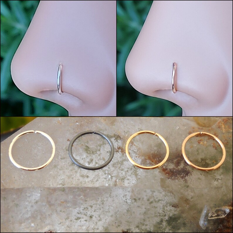 May include: Three nose rings in different colors: gold, silver, and black. The rings are shown on a white background.