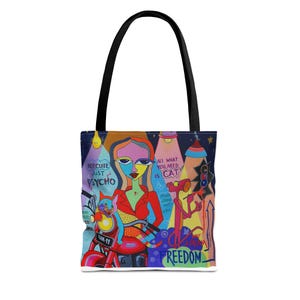 May include: A colorful tote bag with a black handle. The bag features an illustration of a woman on a motorcycle with a cat, the Pink Panther, and text that reads "Not Cute Just Psycho" and "All You Need Is Cat."