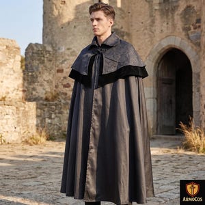 May include: A dark gray cloak with a patterned collar and black velvet trim. The cloak is long and flowing, with a button closure at the neck. The image is set against a stone building background, suggesting a historical or fantasy theme.