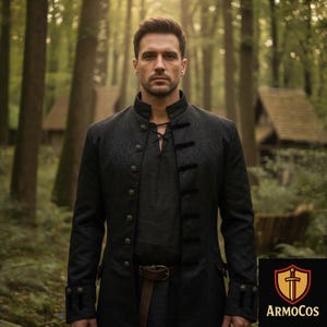 May include: A black, long-sleeved coat with a textured floral pattern, featuring a mandarin collar and decorative buttons. The coat is paired with a dark shirt and a brown belt. The image is set in a forest, with the ArmoCos logo in the bottom right corner.