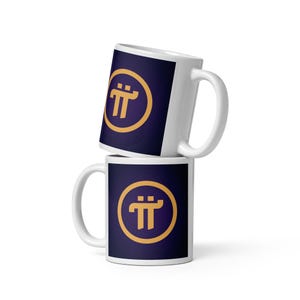 May include: Two white ceramic mugs stacked on top of each other. Each mug features a dark blue background with a gold-colored symbol inside a gold circle. The mugs have a standard handle design.