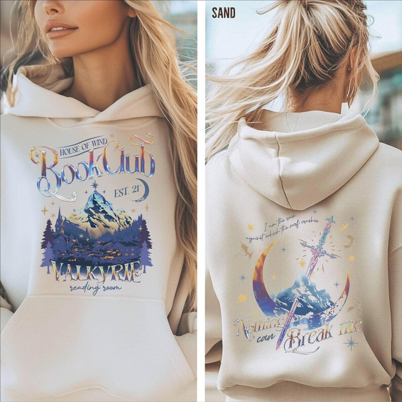a woman wearing a white hoodie with a graphic design on the front and back.