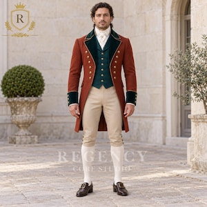 May include: A rust-colored tailcoat with dark green velvet lapels and cuffs, featuring gold buttons. Worn with a dark green waistcoat, white cravat, beige knee-length breeches, white stockings, and dark brown leather buckled shoes.
