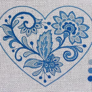 May include: A heart-shaped needlepoint canvas featuring a blue floral design. The design includes stylized flowers, leaves, and swirls, all in shades of blue. The canvas is on a white background with a grid pattern, and a color palette is on the right.