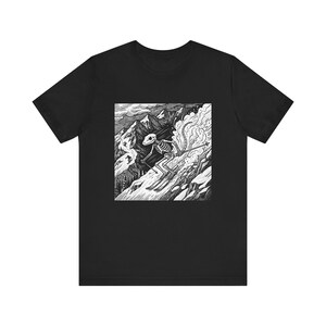 May include: Black t-shirt featuring a black and white graphic of a skeleton skiing down a mountain. The illustration shows the skeleton in motion, with skis and poles, against a backdrop of snow-covered peaks and clouds. A unique design for those who love skiing.