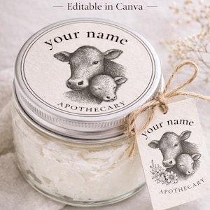 May include: A glass jar with a silver lid, filled with a white substance. The lid features a cow illustration and the text "your name APOTHECARY". A tag with the same cow illustration hangs from the jar. Text at the top reads "Tallow Branding Kit".
