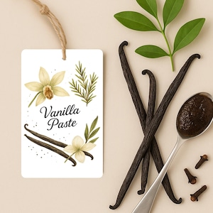May include: A white tag with the words "Vanilla Paste" and floral illustrations hangs next to vanilla beans, a spoon of paste, cloves, and green leaves. The image has a neutral color palette.