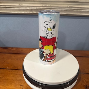 20 oz Snoopy and gang tumbler . great for hot and cold drinks, and it comes with a straw