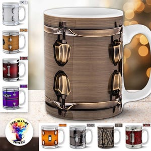 May include: A collection of ceramic mugs featuring drum kit designs. The main mug has a bronze-colored drum finish with brass-colored hardware. Additional mugs showcase various drum finishes, including wood grain, red, purple, and silver. The mugs have white handles.