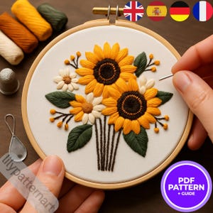Puede incluir: Diseño floral bordado con girasoles y margaritas en un aro de madera. Las flores son amarillas, blancas y marrones con hojas verdes. El texto "PDF PATTERN + GUIDE" está en un círculo morado.