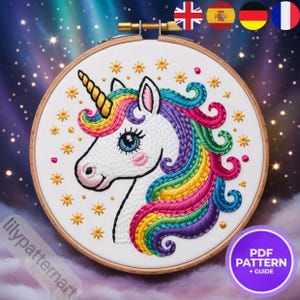 Peut inclure: Broderie d'un motif de licorne avec une crinière arc-en-ciel et une corne dorée, dans un cercle en bois. Le fond est étoilé, avec de petites étoiles dorées. Le texte "PDF PATTERN + GUIDE" est visible.