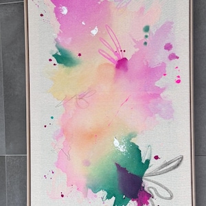 May include: A rectangular framed canvas featuring an abstract painting with vibrant watercolor-style splashes in shades of magenta, yellow, and green. The composition includes delicate hand-drawn line work and scattered paint splatters.