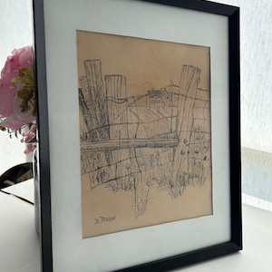 May include: Framed black and white sketch of a rural landscape. The artwork depicts a wooden fence with barbed wire, a field, and a distant house. The sketch is on tan paper, framed with a white mat and black frame. Signed "B. Perrin".