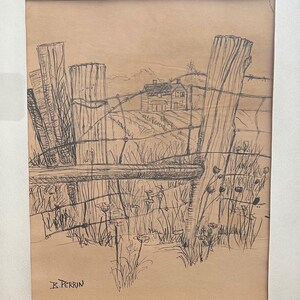 May include: A framed pen and ink drawing of a rural landscape. The artwork depicts a weathered wooden fence with barbed wire, a distant house, and fields. The artist's signature, "K. Perrin," is visible in the lower left corner.