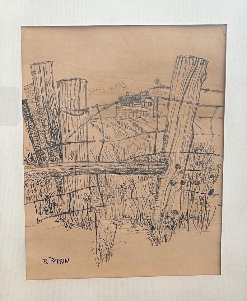 May include: A framed pen and ink drawing of a rural landscape. The artwork depicts a weathered wooden fence with barbed wire, a distant house, and fields. The artist's signature, "K. Perrin," is visible in the lower left corner.
