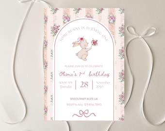 May include: A floral-themed birthday invitation with the text "Some Bunny is Turning One." The invitation features a watercolor illustration of a bunny holding flowers. The invitation includes the birthday details: Olivia's 1st birthday, date, time, and RSVP information.