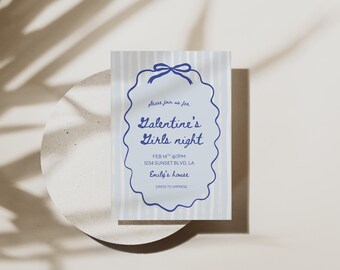 May include: A light blue and white striped invitation card with a blue scalloped border and bow. The text reads "Galentine's Girls night" with event details. The card is on a white circular surface.