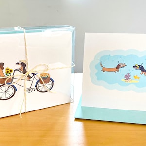 Biglietti di auguri assortiti con bassotti in viaggio con scatola di cancelleria (set da 10)