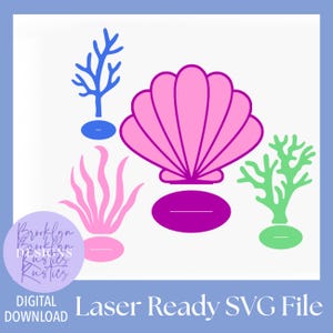 May include: A digital laser-ready SVG file featuring a large pink seashell with a dark purple base, a blue coral branch, a light pink sea plant, and a light green coral branch, each with its own base, against a plain white background.