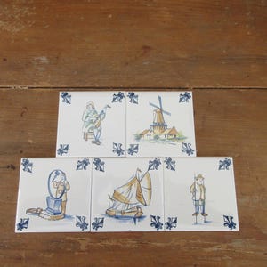 May include: A white ceramic mug with a black handle and the text "But First, Coffee" in a black, bold font. The mug is on a white surface.