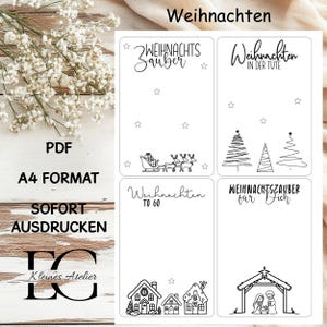 May include: A white printable sheet with Christmas-themed designs. The sheet includes illustrations of a sleigh with reindeer, Christmas trees, houses, and a nativity scene. Text includes "Weihnachten", "ZWEHNACHTS Zauber", and "A4 FORMAT".