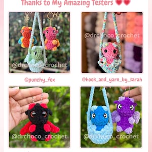 May include: A collection of handmade crochet dragon keychains in various colors, including red, orange, pink, green, blue, and purple. Each dragon is suspended in a small crocheted carrier or hanging from a keychain. The text "Thanks to My Amazing Testers" is at the top.