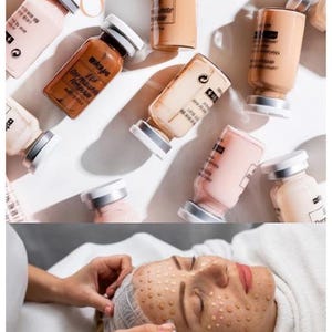 May include: A selection of small glass bottles with silver lids, containing different coloured liquids, scattered on a white surface. The text "BUILD YOUR PORTFOLIO" is at the top. A person's face is shown with dots of liquid.