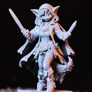 May include: A white ceramic mug with a black handle and the text "But First, Coffee" in a bold, black font. The mug is set against a neutral background, highlighting its simple design.