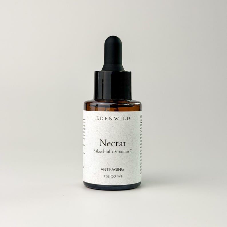 May include: A brown glass bottle of Nectar anti-aging serum with a black dropper. The label reads "EDEN WILD" and "Nectar Bakuchiol + Vitamin C". The bottle contains 1 oz (30 ml) of product.