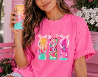 Alani Energy Drink T-Shirt – Bright Pink or Baby Blue Graphic Tee with Bow Cans, Trendy Gift for Women