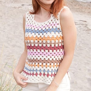 May include: A colorful crochet tank top with a square neckline. The top features horizontal stripes in cream, pink, blue, orange, brown, and burgundy. The open weave design is visible. The tank top is sleeveless.