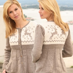 May include: A beige and cream button-up cardigan featuring a knit pattern of reindeer and geometric shapes across the upper chest and back. The garment has long sleeves, a round neckline, and a ribbed texture on the lower body and sleeves.
