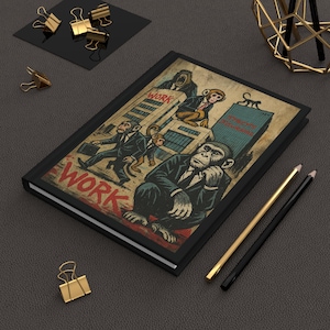 May include: Black hardcover journal featuring a vintage-style illustration of monkeys in suits, with the word "WORK" prominently displayed. The artwork depicts monkeys in a city setting, with skyscrapers in the background.