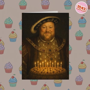May include: A greeting card featuring a portrait of a bearded man in a dark velvet hat and ornate gold-trimmed clothing, holding a lit birthday cake with candles. The background is a light brown pattern of colourful cupcakes and a circular 1543 tag.