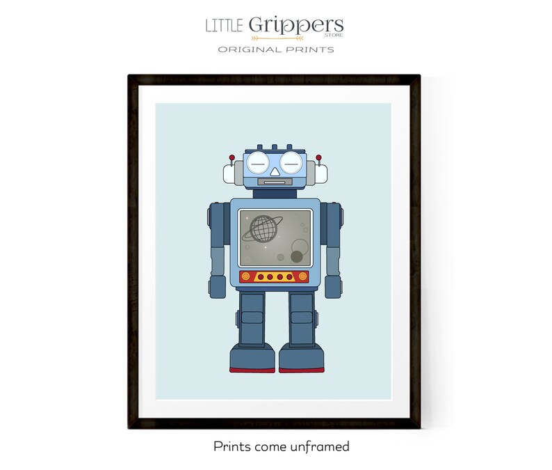 May include: Framed print featuring a blue robot illustration with a screen displaying a planet and stars. The robot has red accents and is set against a light blue background. The text "LITTLE GRIPPERS STORE ORIGINAL PRINTS" is at the top. The text "Prints come unframed" is at the bottom.