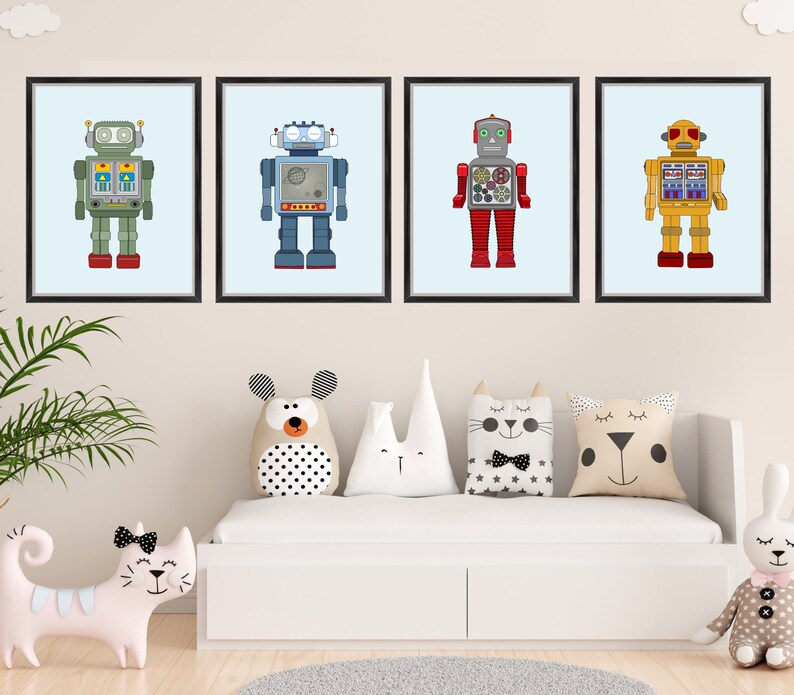 May include: Four framed art prints featuring colorful robot illustrations. Each robot has a unique design with different colors, including green, blue, red, and yellow. The prints are displayed above a white bed with decorative pillows.