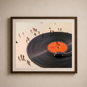 May include: Framed art print featuring a large vinyl record with an orange center label. Miniature figures are scattered around the record, creating a surreal scene. The record player needle is in place, and the frame is a dark brown.