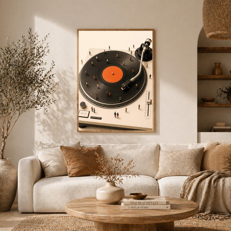 May include: A framed wall art print featuring a high-angle view of a cream-colored turntable with a black vinyl record. Tiny human figures are scattered across the record surface and the turntable deck, creating a surreal, miniature-scale scene.